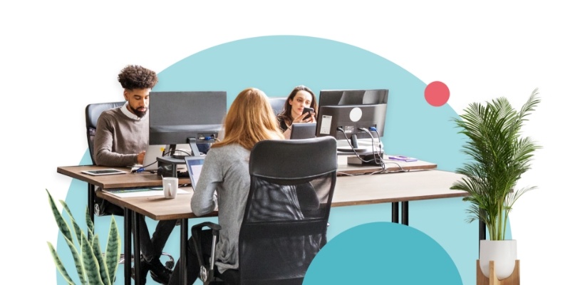 Three people working in a shared office