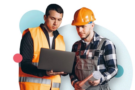 Two working men at a laptop